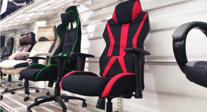 A selection of gaming chairs and ergonomic office chairs in a showroom