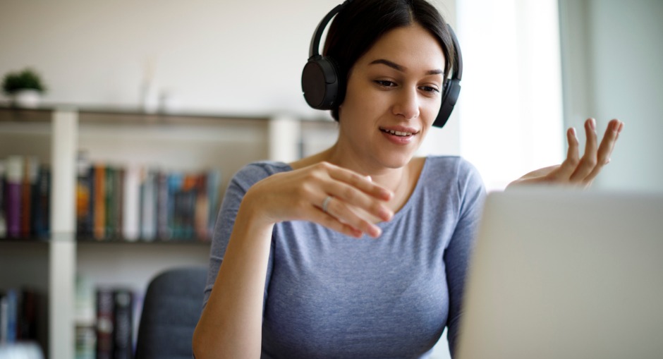  Female office worker working from home conducting a WHS check in