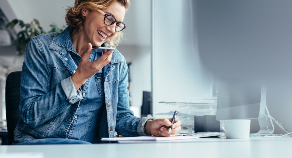  Mature aged office worker on the phone discussing her home office tax deductions