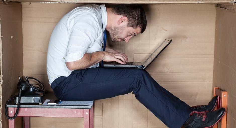 office worker, working from a cramped workstation