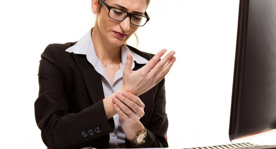 A professional woman suffering from a sore wrist, due to over use of a conventional mouse